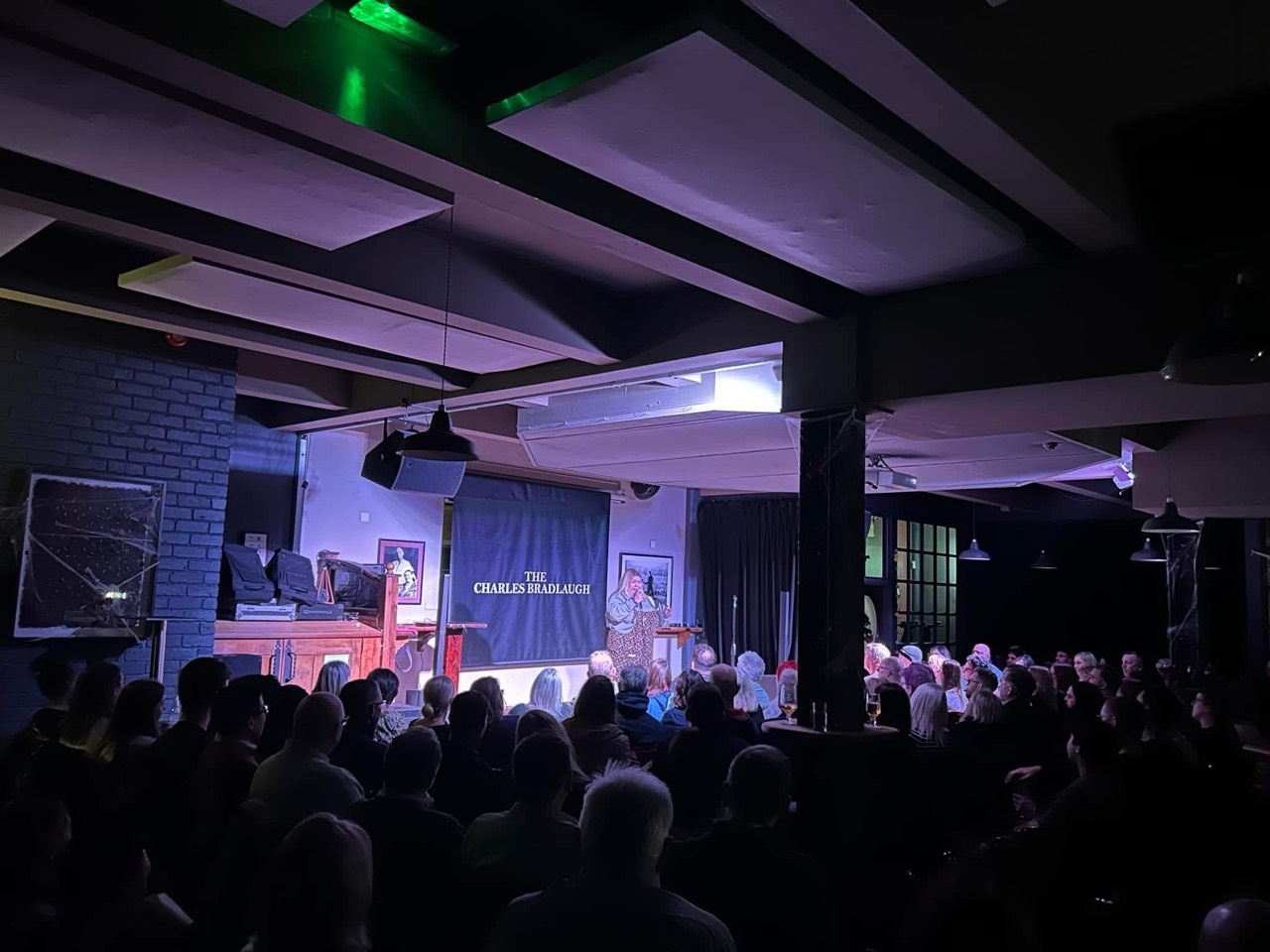A full audience watching the stage at The Charles Bradlaugh