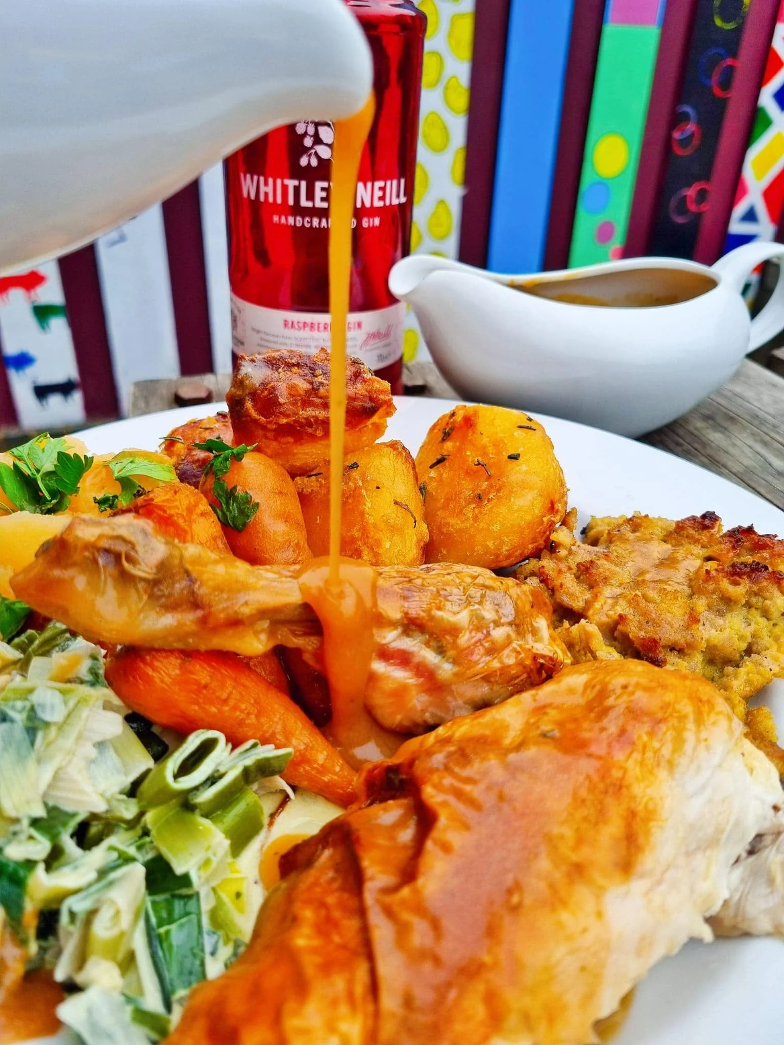 Gravy poured over a Sunday roast chicken plate at The Charles Bradlaugh