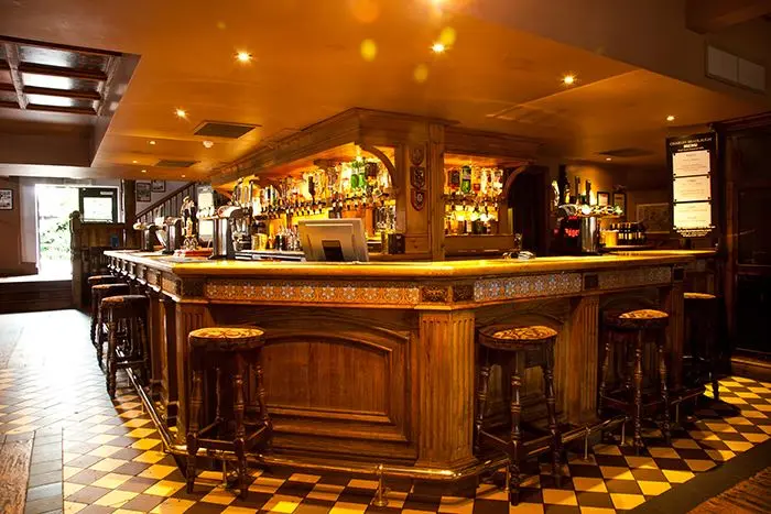 The wooden bar and interior at The Charles Bradlaugh